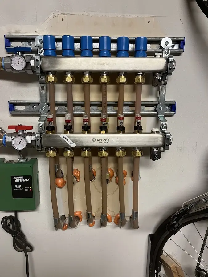 Plumber performing Water Heater Repair at a residential property in Wayne